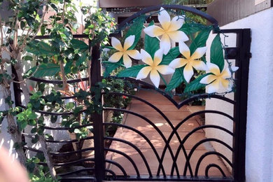 Inspiration for a mid-sized tropical beige one-story stucco exterior home remodel in Hawaii with a hip roof