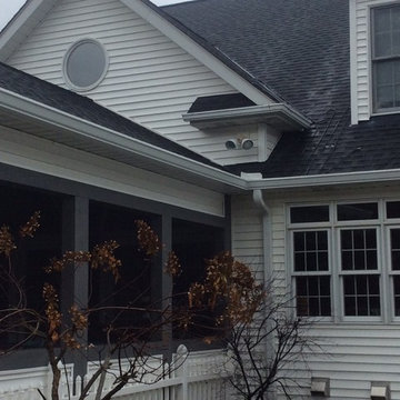 Removed siding and roofing at dormer wall. Installed ice guard,new flashing and
