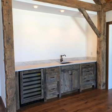 Custom built bar utilizing 220 year old reclaimed barn beams