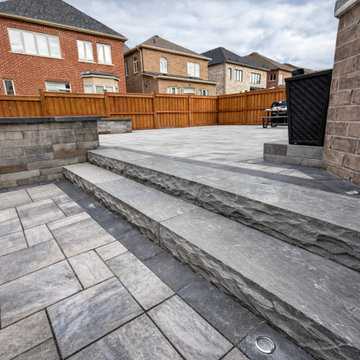 Backyard Patio Transformation – Unilock Trevista Pavers, Natural Stone Steps & L