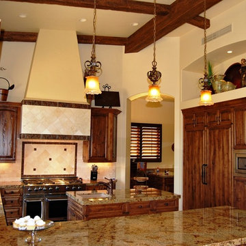 Old World Tuscan Kitchen with Paneled Refers