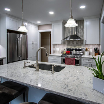 Grey and White Shaker Kitchen with Quartz Countertops and Picket-Style Tile