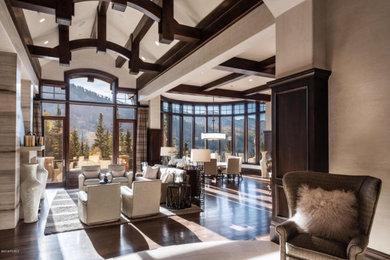 Entryway - huge transitional dark wood floor and brown floor entryway idea in Salt Lake City with brown walls and a dark wood front door