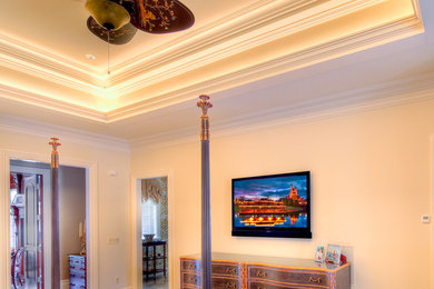 Elegant medium tone wood floor bedroom photo in Detroit with yellow walls