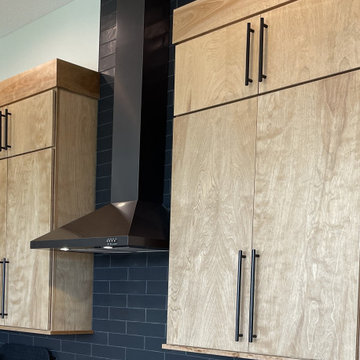 Angled Kitchen Design with Slab Style Cabinets in Pecan Stain