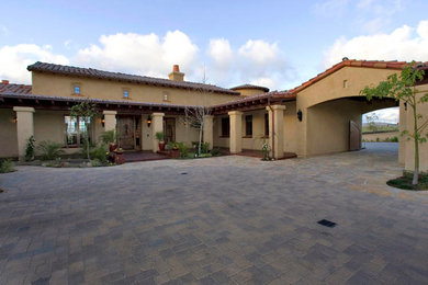 Example of a tuscan home design design in San Diego