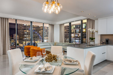 Living room - mid-sized modern formal and open concept porcelain tile and gray floor living room idea in Miami with gray walls and a wall-mounted tv