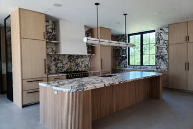 Inspiration for a contemporary kitchen remodel in Denver with flat-panel cabinets, light wood cabinets and an island