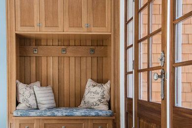 Entryway - traditional entryway idea in Boston with blue walls and a dark wood front door