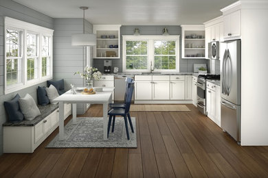 Example of a transitional kitchen design in Portland with shaker cabinets and white cabinets