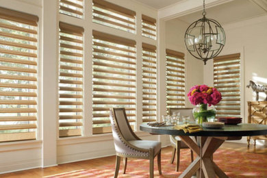 Example of a cottage chic dining room design in New York
