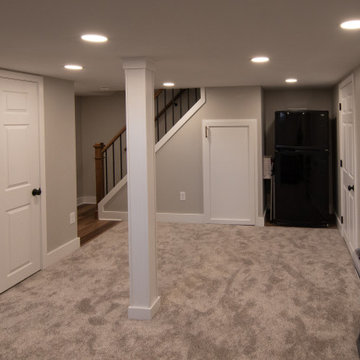 Bathroom/Laundry Room Using Warmer Tones, Accented by New Laundry Facility