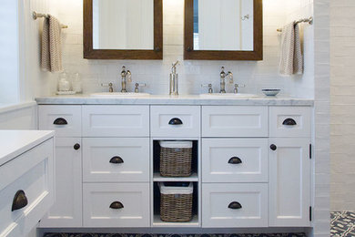 Inspiration for a large country master bathroom in Sydney with recessed-panel cabinets, white cabinets, white walls, a drop-in sink, marble benchtops, an open shower, white tile, ceramic tile and cement tiles.