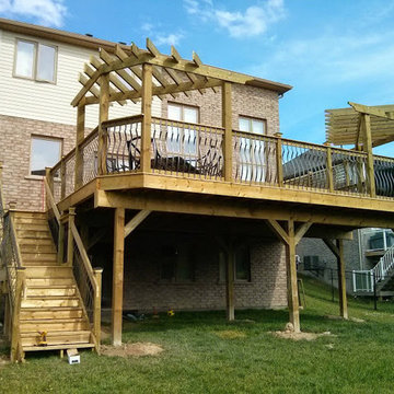 A triumphant 38x22 deck with triangular pergolas