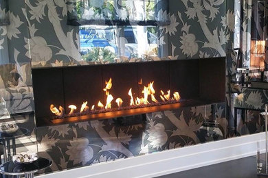 Inspiration for an eclectic living room remodel in New York with a ribbon fireplace and a metal fireplace