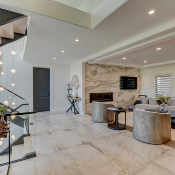 Voyage | Custom multi‑story chandelier with cascading glass pendants