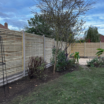 Slatted Fence Panels on Concrete Posts and Gravel Boards