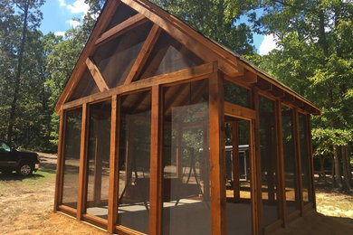Example of a mid-sized mountain style wood gable roof design in New Orleans with a shingle roof