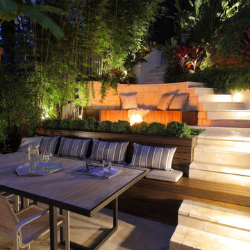 Multi-Tier Landscape Design with Built-In Seating and Paved Walkways
