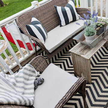 Sunbrella patio seat cushions create neutral backdrop on deck