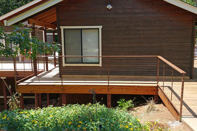 Inspiration for a large contemporary backyard deck remodel in Sacramento with no cover