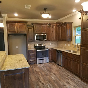 Spacious kitchen, stainless appliances, granite, travertine back splash.