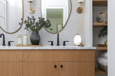 Inspiration for a small mid-century modern master porcelain tile, white floor and double-sink bathroom remodel in Other with flat-panel cabinets, brown cabinets, a one-piece toilet, white walls, an undermount sink, marble countertops, a hinged shower door, white countertops and a built-in vanity