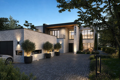 Minimalist white two-story brick and board and batten flat roof photo in Other with a mixed material roof and a white roof