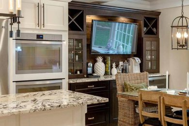 Inspiration for a mid-sized timeless light wood floor and brown floor kitchen/dining room combo remodel in Boston with beige walls and no fireplace
