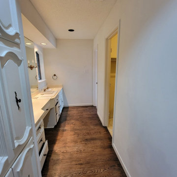 Two separate bathrooms converted into a master bathroom with a big open closet