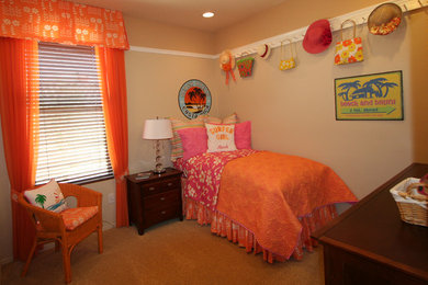 Example of a beach style carpeted bedroom design in Phoenix with beige walls