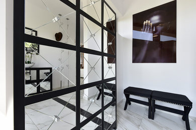 Inspiration for a modern ceramic tile and white floor vestibule remodel in Other with white walls