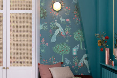 This is an example of a medium sized bohemian teen’s room for girls in Paris with blue walls, light hardwood flooring, brown floors, a vaulted ceiling and wallpapered walls.