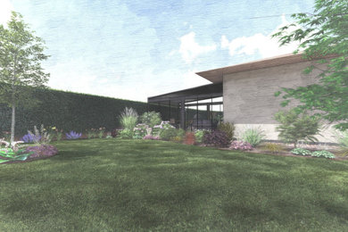 Immagine di un grande giardino formale minimalista in ombra davanti casa con un ingresso o sentiero, pavimentazioni in mattoni e recinzione in metallo