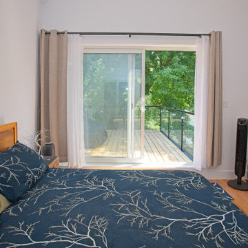 Bedroom View Through Sliding Glass Doors to the Upper Deck | East York