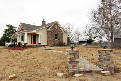 Inspiration for a mid-sized farmhouse beige one-story concrete fiberboard exterior home remodel in Birmingham