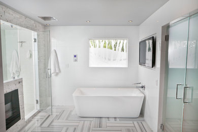 This is an example of a modern bathroom in Louisville with a freestanding tub.