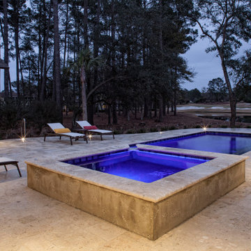Rice Hope Elevated Spa Spilling into Elegant Pool