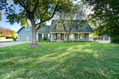 Photo of a country home design in Wichita.
