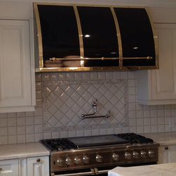 Black gloss color match with polished brass wall mount range hood by Custom Rang - Range Hoods And Vents