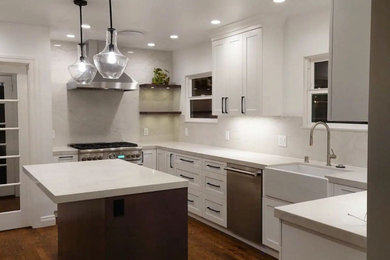 Eat-in kitchen - mid-sized transitional u-shaped eat-in kitchen idea in San Francisco with shaker cabinets, white cabinets, quartz countertops, white backsplash, quartz backsplash, stainless steel appliances, an island and white countertops