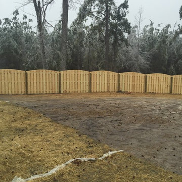 Arched shadow box fence
