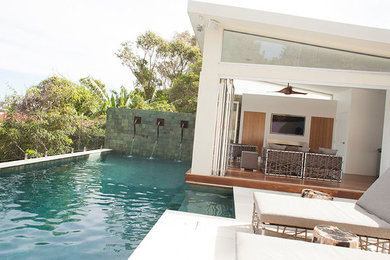 Design ideas for a modern backyard rectangular pool in Central Coast with tile.