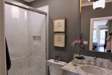 Inspiration for a mid-sized transitional 3/4 white tile and porcelain tile dark wood floor, brown floor and single-sink bathroom remodel in San Francisco with raised-panel cabinets, white cabinets, a two-piece toilet, gray walls, an undermount sink, marble countertops, white countertops, a niche and a built-in vanity