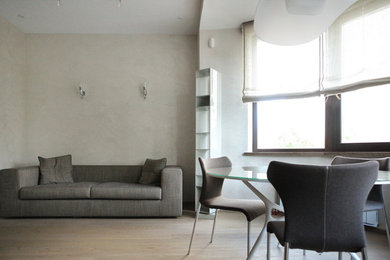 Inspiration for a contemporary living room in Alicante-Costa Blanca with beige walls and medium hardwood floors.