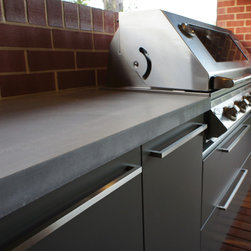 Outdoor Kitchen with a polished concrete benchtop & stainless steel doors. - Kitchen Products