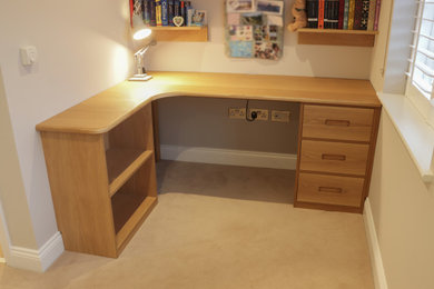 This is an example of a contemporary home office in Kent with a built-in desk.