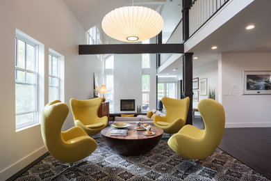 Living room - mid-sized contemporary open concept dark wood floor living room idea in Other with white walls and a concealed tv