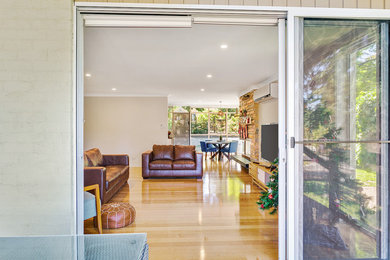 Photo of a large contemporary home design in Melbourne.