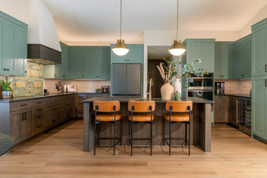 Example of a transitional kitchen design in Denver